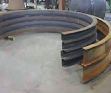 A large metal ring sitting in the middle of a room.