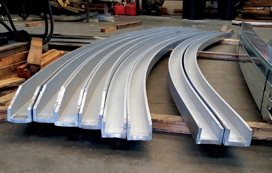 A group of curved metal rails sitting on top of a floor.