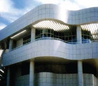 A building with a curved balcony and a sky background